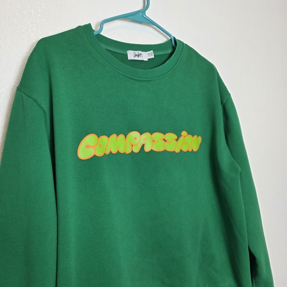 The Mayfair Group Compassion Graphic Sweatshirt In Green - Picture 5 of 10